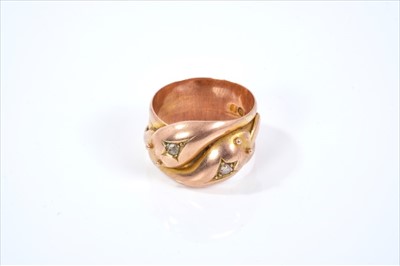 Lot 433 - 9ct rose gold diamond set double snake ring