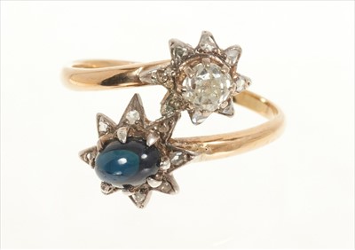 Lot 434 - Diamond and sapphire cross over ring