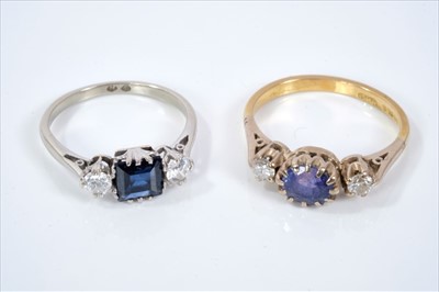 Lot 437 - Sapphire and diamond three stone ring and an amethyst and diamond three stone ring (2)