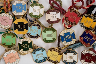 Lot 802 - Collection of enamel racing badges for Towcester Race Club comprising: 1977, 1979-1989, 1991, 1993-1997 (18 items)