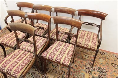 Lot 1369 - Set of eight Regency bar back dining chairs, each with pierced horizontal splat and slip in seat on sabre legs, to include a pair of scroll arm carvers