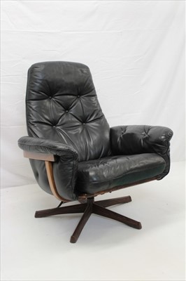 Lot 1391 - Eames style leather swivel chair