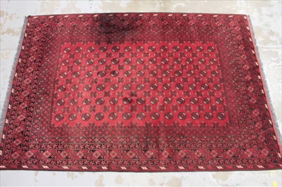 Lot 1429 - Large Bokhara style rug, having six rows of twelve quartered medallions on red ground, 200 x 300cm