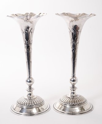Lot 202 - Pair of large Silver Trumpet Vases with knopped stems on circular fluted bases.
