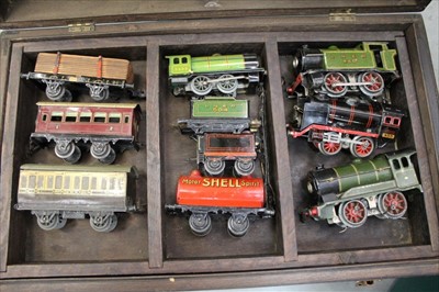 Lot 1393 - Railway 0 gauge selection including Hornby tank locomotives, carriages and rolling stock, large tinplate bridge and trucks housed in wood