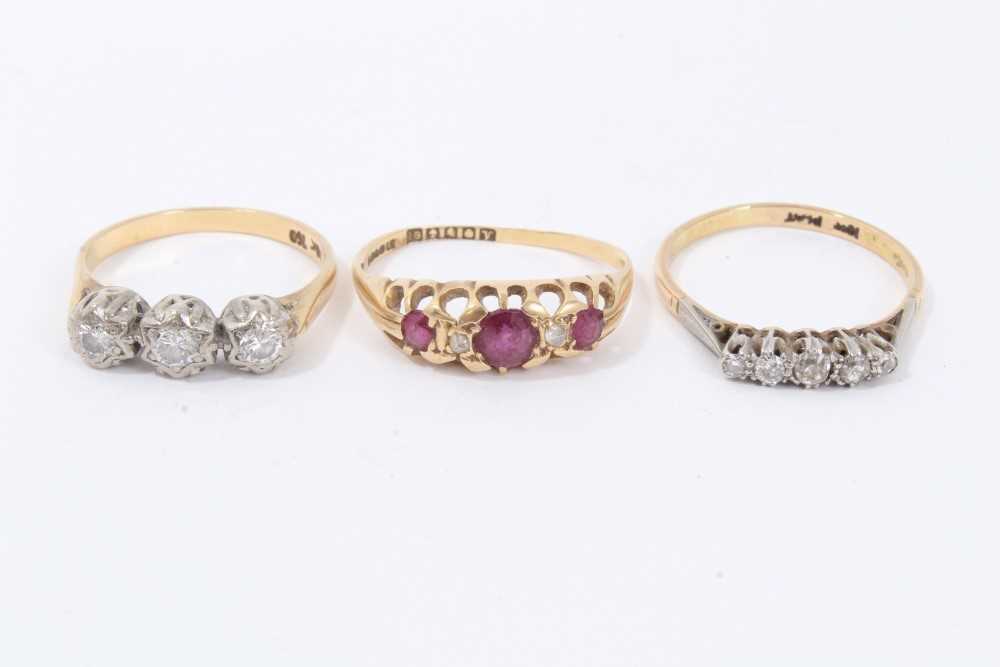 Lot 70 - Two 18ct gold and diamond rings in platinum setting, together with an 18ct gold ruby and diamond ring
