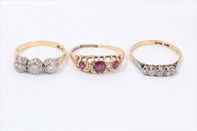 Lot 70 - Two 18ct gold and diamond rings in platinum setting, together with an 18ct gold ruby and diamond ring