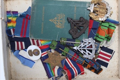 Lot 607 - Second World War medal group comprising 1939 - 1945 Star, France and Germany Star, Defence and War Medals together with Second World War Economy issue Reconnaissance Corps Cap badge, another badge,...