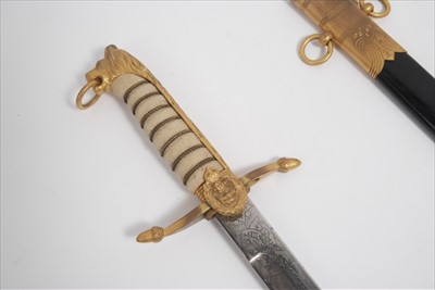 Lot 751 - George V Royal Navy Midshipman's Dirk, with Lions head pommel, wire bound shagreen grip, curved cross guard with acorn terminals and etched blade with Fouled anchor, scroll and cipher decoration by...