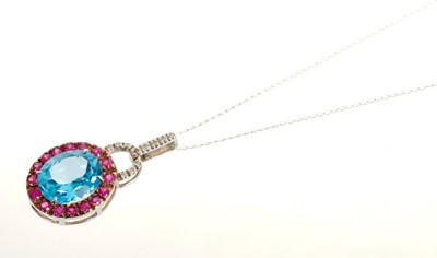 Lot 477 - Blue topaz, ruby and diamond pendant in 14ct white gold setting