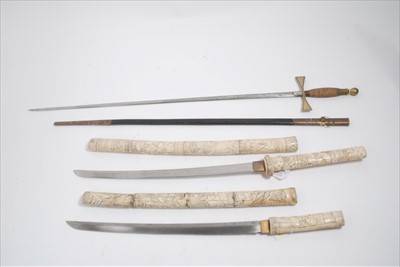 Lot 763 - Masonic sword with cruciform hilt, etched blade in scabbard and two early 20th century Japanese carved ivory mounted ornamental swords (3)