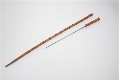 Lot 771 - 19th century bamboo dagger stick with hollow ground blade and another dagger stick (2)