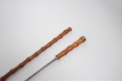 Lot 771 - 19th century bamboo dagger stick with hollow ground blade and another dagger stick (2)