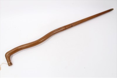 Lot 806 - Early 19th century air gun stick of crooked metal form with painted grained wood finish ,95cm overall