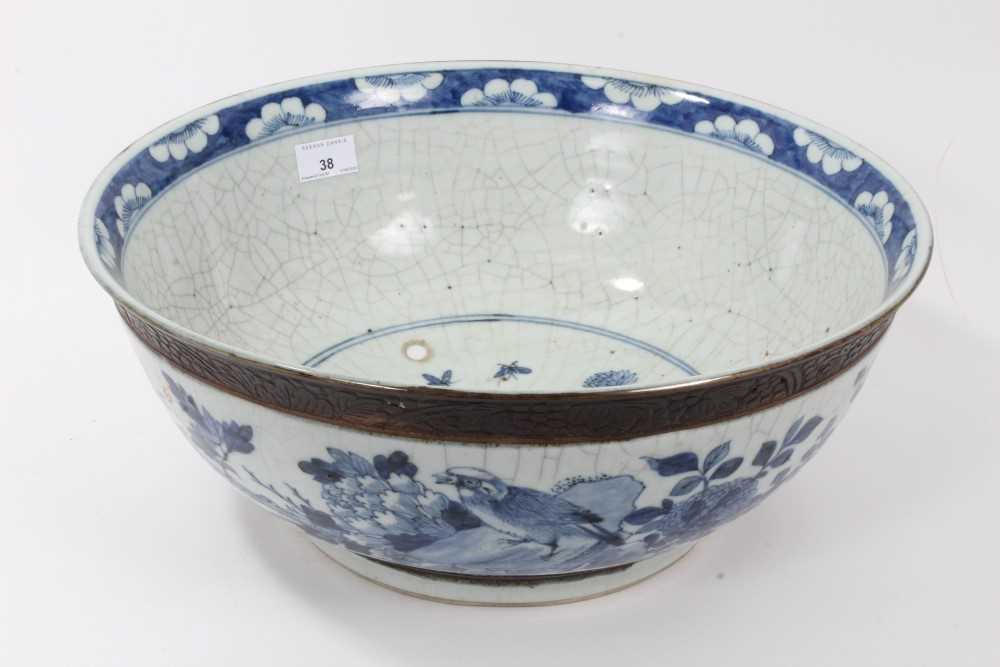 Lot 38 - Large late 19th/early 20th century Chinese crackle glaze blue and white bowl, painted with birds and flowers, etched mark to base, 41.5cm diameter