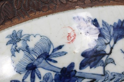Lot 38 - Large late 19th/early 20th century Chinese crackle glaze blue and white bowl, painted with birds and flowers, etched mark to base, 41.5cm diameter