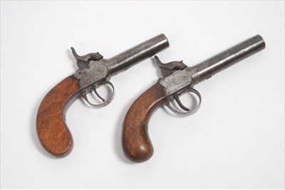 Lot 810 - Two 19th century percussion box lock pocket pistols with floral scrollwork and walnut bag grips (2)