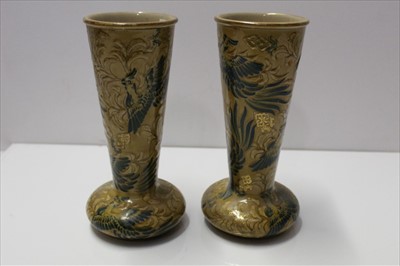 Lot 921 - Pair of Doulton Lambeth vases with painted bird decoration on brown ground, impressed factory mark, 21.5cm high