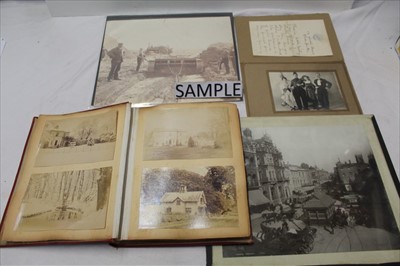 Lot 1088 - Photographs in album or mounted on loose pages.  Mainly Victorian including 'Nurses Sailing for S. African War', Girls cricket team, Steam Engine and men working on beach, Ipswich Corn hill, busy s...