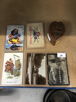 Lot 88 - First World War Trench Art carved wooden box and First World War postcards