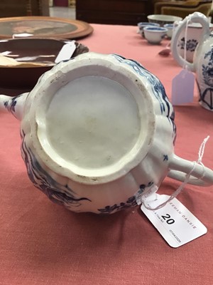 Lot 20 - Worcester teapot and cover, circa 1755, of lobed form, painted in blue with the Prunus Root pattern, 18cm length