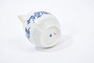 Lot 24 - Worcester barrel shaped jug, circa 1760-65, painted with floral sprays, crescent mark to base, 6.5cm height