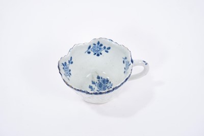 Lot 29 - Bow blue and white butter boat, circa 1765, painted with floral sprays, 8.5cm length