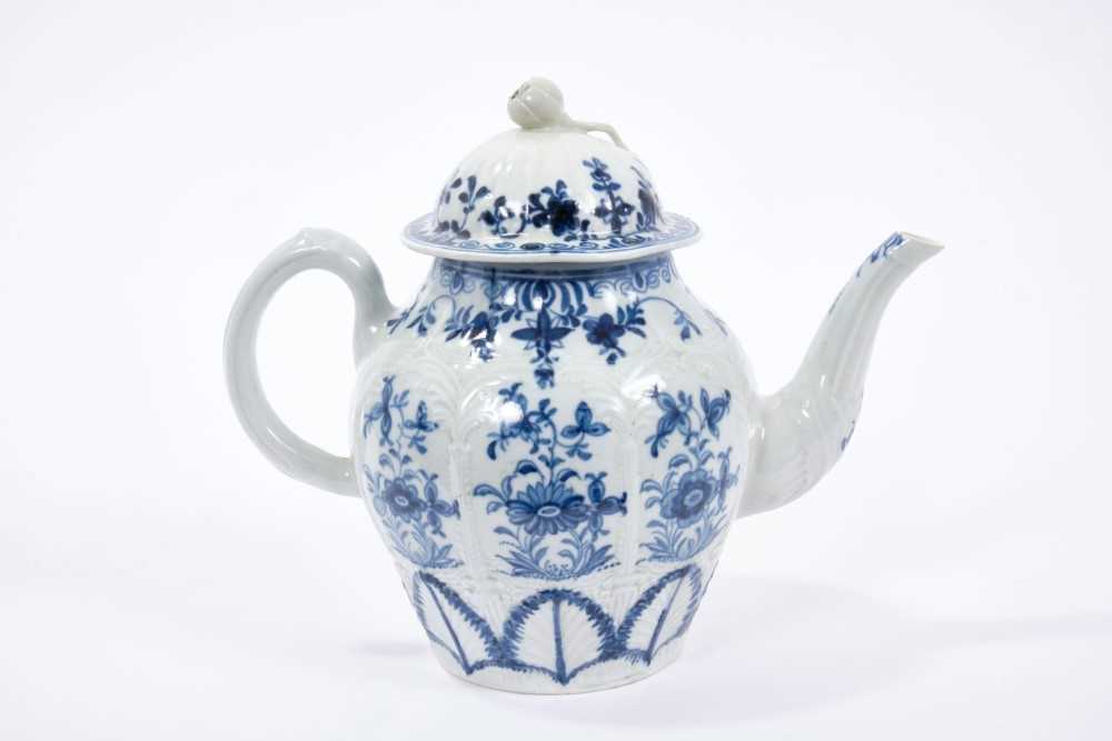 Lot 35 - Liverpool Christians blue and white teapot, circa 1770, feather moulded and painted with panels of flowers, the lid with a flower finial, 15cm height