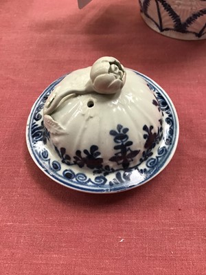 Lot 35 - Liverpool Christians blue and white teapot, circa 1770, feather moulded and painted with panels of flowers, the lid with a flower finial, 15cm height