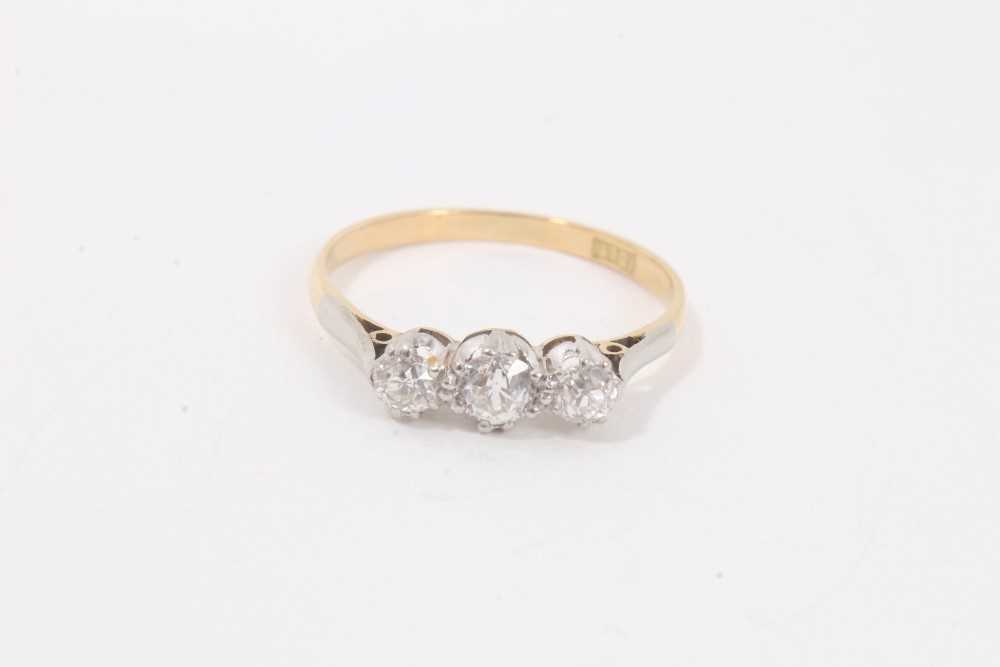 Lot 115 - Ladies 18ct gold and diamond three stone ring