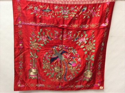 Lot 1644 - Chinese embroidered red silk alter panel c19th century couch and satin stitch, vases of flowers and exotic birds and bats.  Lined in Chinese floral printed cotton.