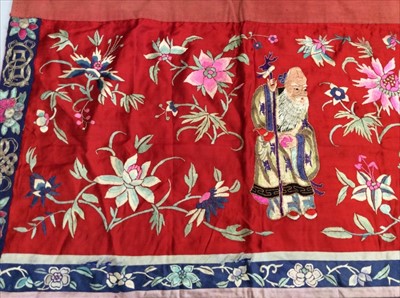 Lot 1647 - Chinese embroidered red silk panel c19th century couch and satin stitch, figures and flowers. Embroidered silk border with symbols and flowers.. Scrolling border with exotic birds and flowe...