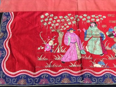 Lot 1648 - Chinese embroidered red silk panel c19th century couch and satin stitch, figures and flowers. Embroidered silk border with symbols and flowers. . Scrolling border with flowers. Lined with red cotto...