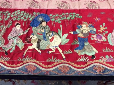 Lot 1649 - Chinese long embroidered red silk panel c19th century couch and satin stitch figures in garden scene with pagoda and horses etc. Lined with Chinese floral printed cotton with fring...