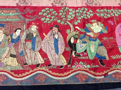 Lot 1649 - Chinese long embroidered red silk panel c19th century couch and satin stitch figures in garden scene with pagoda and horses etc. Lined with Chinese floral printed cotton with fring...