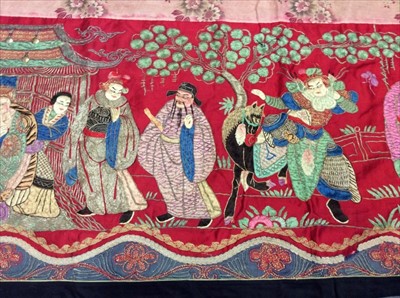 Lot 1649 - Chinese long embroidered red silk panel c19th century couch and satin stitch figures in garden scene with pagoda and horses etc. Lined with Chinese floral printed cotton with fring...