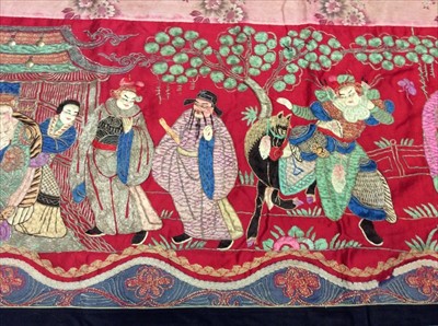 Lot 1649 - Chinese long embroidered red silk panel c19th century couch and satin stitch figures in garden scene with pagoda and horses etc. Lined with Chinese floral printed cotton with fring...