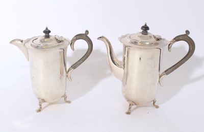 Lot 219 - George V silver hot water jug and matching coffee pot, each with fluted rims