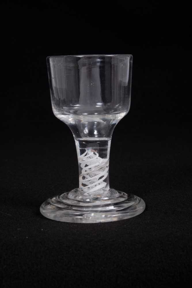 Lot 4 - Georgian firing glass, with an ogee bowl on a double series opaque twist stem, above a stepped foot, circa 1760, 9.5cm height