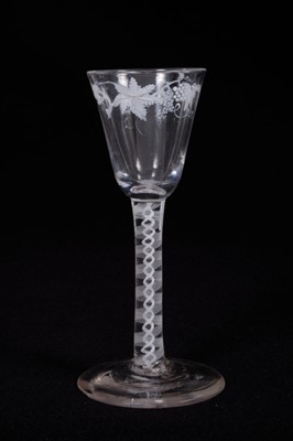 Lot 2 - Fine Georgian wine glass, the funnel bowl painted in the Beilby style with grapevines in white enamel, on a double series opaque twist stem, on a conical foot, circa 1770, 14.25cm height