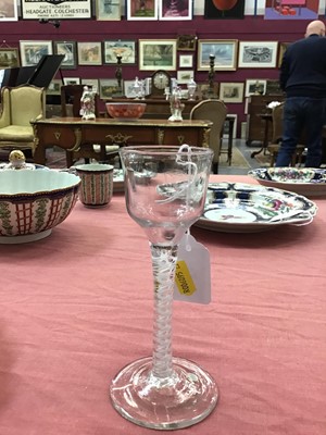 Lot 14 - 18th century wine glass with multi-spiral airtwist stem, together with an 18th century opaque twist glass with ogee bowl (2)