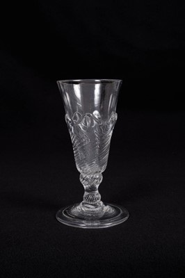 Lot 10 - Georgian flamiform wrythen ale glass, the moulded round funnel bowl on a folded conical foot, circa 1750, 13.75cm height