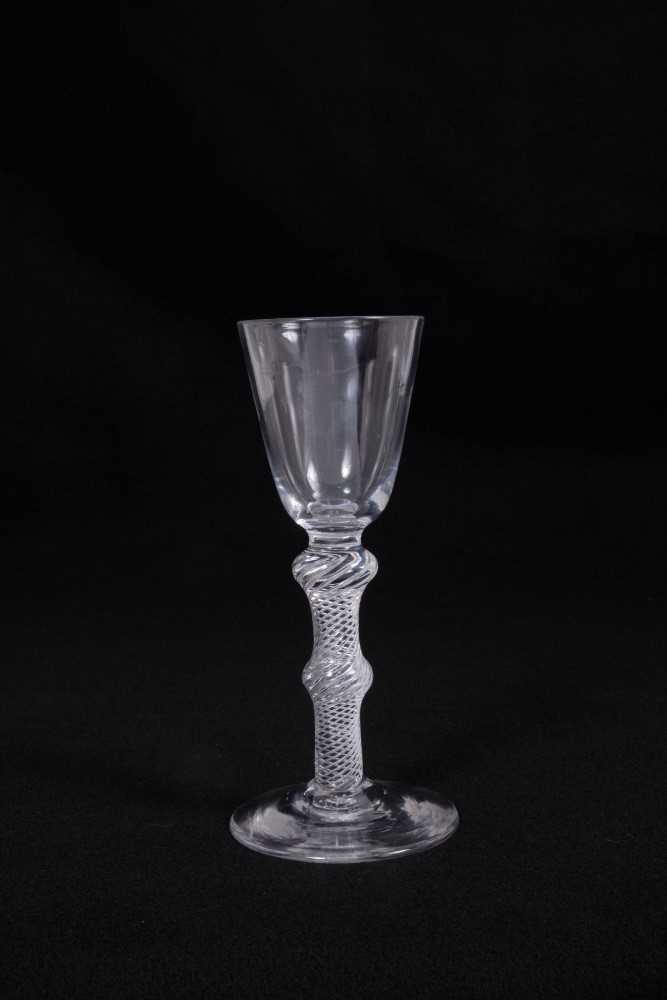 Lot 8 - Georgian wine glass, with a round funnel bowl on a double-knopped multi-spiral air twist stem, above a conical foot, circa 1750, 15.5cm height