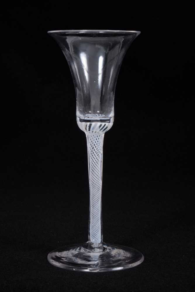 Lot 18 - Georgian wine glass, with a bell-shaped bowl on a single series spiral gauze opaque twist stem, above a conical foot, circa 1760, 18cm height