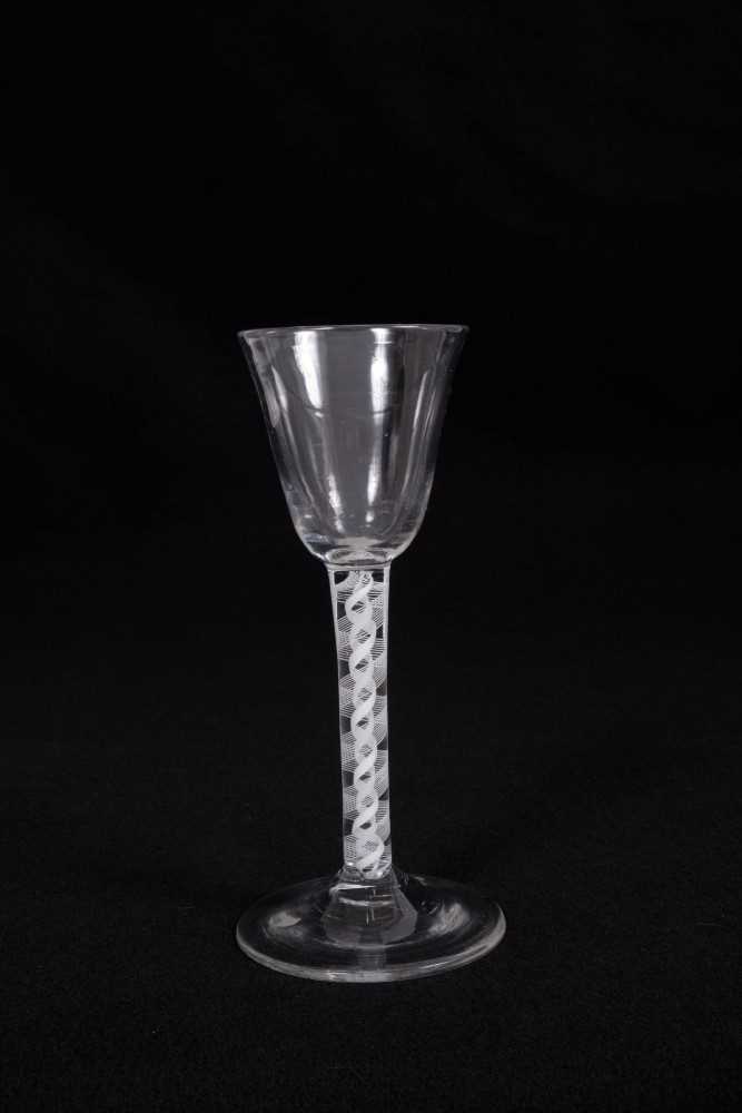 Lot 9 - Georgian wine glass, with a round funnel bowl on a double series opaque twist stem, above a conical foot, circa 1760, 15cm height