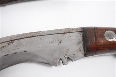 Lot 786 - First World War British Military issue Kukri with broad arrow mark, dated 1916 In leather sheath