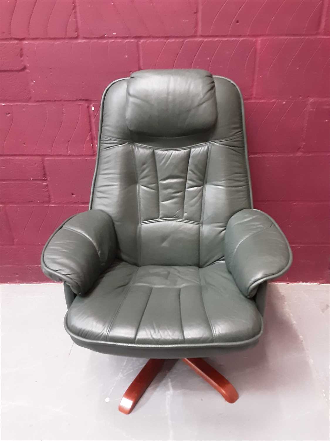 Lot 866 - Modern green leather swivel chair