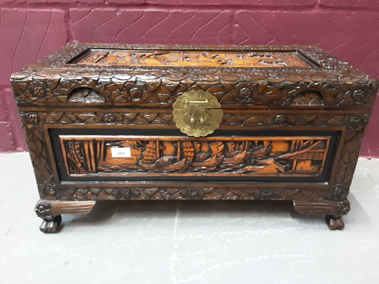 Lot 869 - Oriental carved camphor wood trunk