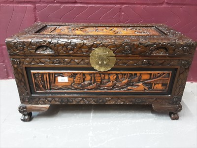 Lot 869 - Oriental carved camphor wood trunk