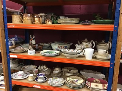 Lot 528 - Three shelves of antique and decorative ceramics including Victorian stoneware mugs, Staffordshire figures, cow creamer, 18th century Worcester teaware including teapot and stand, Limoges etc